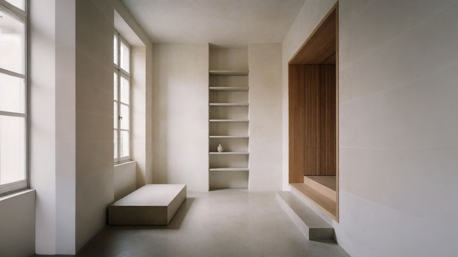 Quiet interior with steps and shelves suggesting the differences between memoir, autobiography, and biography.